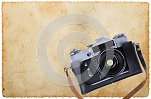Old camera placed on an old paper
