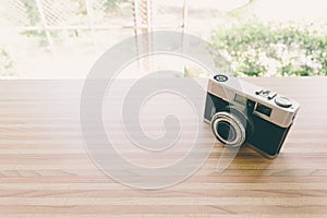 Old camera on wood in coffee shop