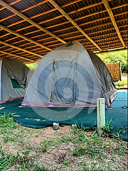 Old camping tent under roof