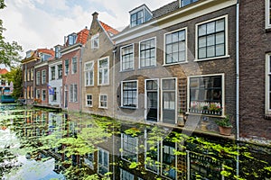 Old canal houses with beautiful reflections in the water in the