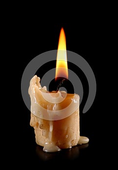 old candle on black background