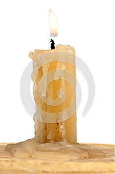 Old candle isolated on a white background