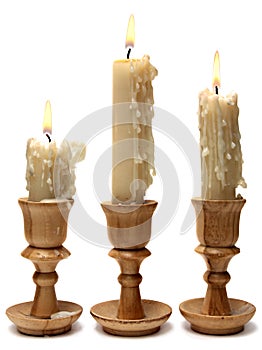 Old candle on white background