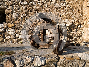 An old cannon against a stone wall at the fortress in Travnik