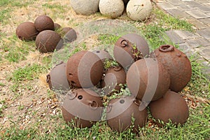 Old cannon balls at Castello Albertis photo