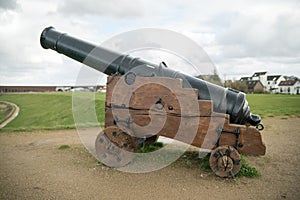 Old cannon on the banks of the river Waal by Nijmegen, The Netherlands