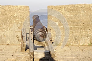 Old Cannon On Fortified Wall In Portuguese Guns, Guarding historical vintage fort.