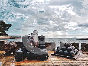 An old cannon guarding the coast and showing how time passes