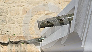 Old cannons used as drainpipes on a house in Faro, Algarve, Portugal