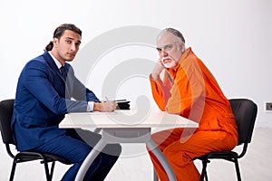 Old captive meeting with advocate in pre-trial detention