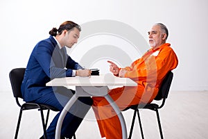 Old captive meeting with advocate in pre-trial detention