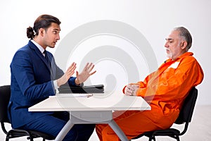 Old captive meeting with advocate in pre-trial detention