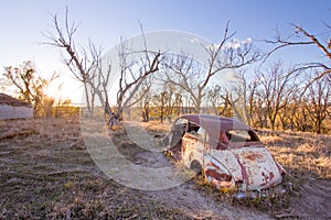An Old Car Abandoned on a Farm