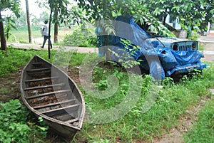 Old car of bangladesh.View of the old car and boat. photo