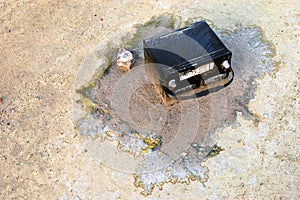 Old Car Battery on the Ground