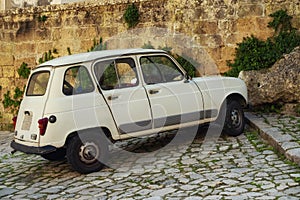 Old car in a beautiful Matera town, Italy