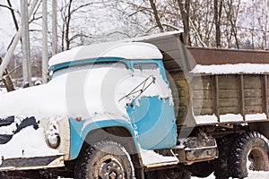 Old car covered with snow