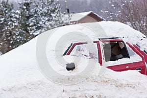 Old car covered with snow