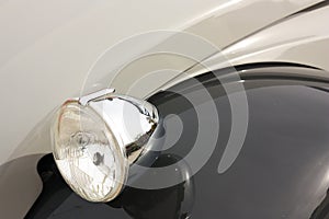 Old car fender and headlight photo