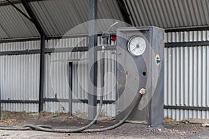 An old car fuel distributor. Abandoned gas station in the countryside