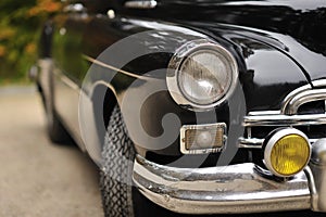 Old car - headlight of a vintage car