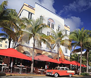 Old car and restaurants on Ocean Drive, Miami Beach photo