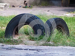 Old car tires dug into the ground