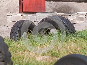 Old car tires dug into the ground