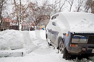 The old car under snow