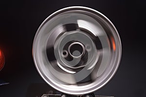 old car wheels titanium rims retro light alloy in a dark room long exposure photo