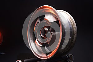 old car wheels titanium rims retro light alloy in a dark room long exposure photo