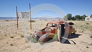 Old car wreck at Gas station Solitaire