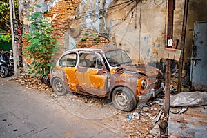 Old car wreck in old alley of talat noi.Talad Noi Talat Noi