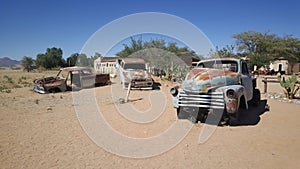 Old car wrecks at Gas station Solitaire in Namibia