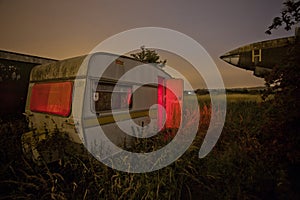 Old caravan in an overgrown field