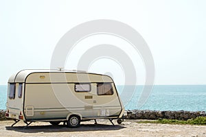 Old caravan on the shore