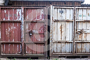 Old Cargo containers with scratch and rust. Steel padlock, metal door of cargo containers