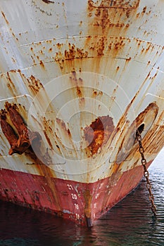 Old cargo ship with rusty anchor