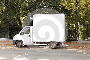 An old cargo van parked on a city street