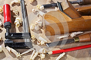 Old carpenter plane tools and wood shavings