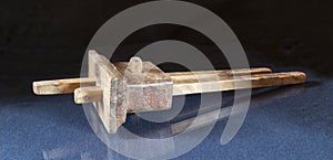 Old carpenter`s measuring tool on the table