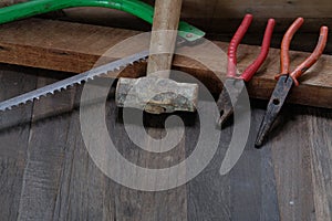 Old carpenter tools on wooden background