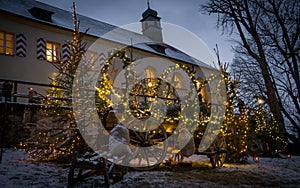 Old carriage in front of christmas church