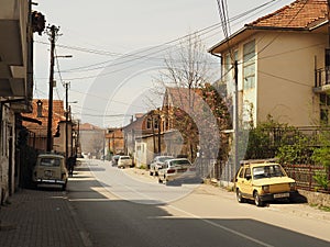 Old cars in North Macedonia near the Ohrid Lake with traditional buildings