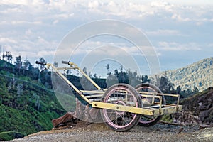 An old cart on a mountain waiting for carrying sulfur down from a mountain