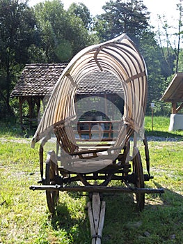 Old cart with tarpaulin