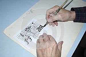 The old cartoonist hands drawing