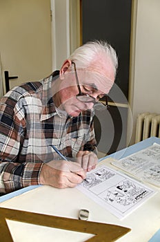 The old cartoonist at work