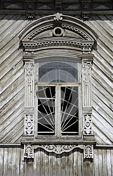 Old carved windows of a wooden house.