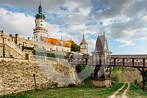 Old carved wooden Jurkovic bridge with charming castle tower in Nove Mesto nad Metuji, pearl of Eastern Bohemia, Czech Republic.